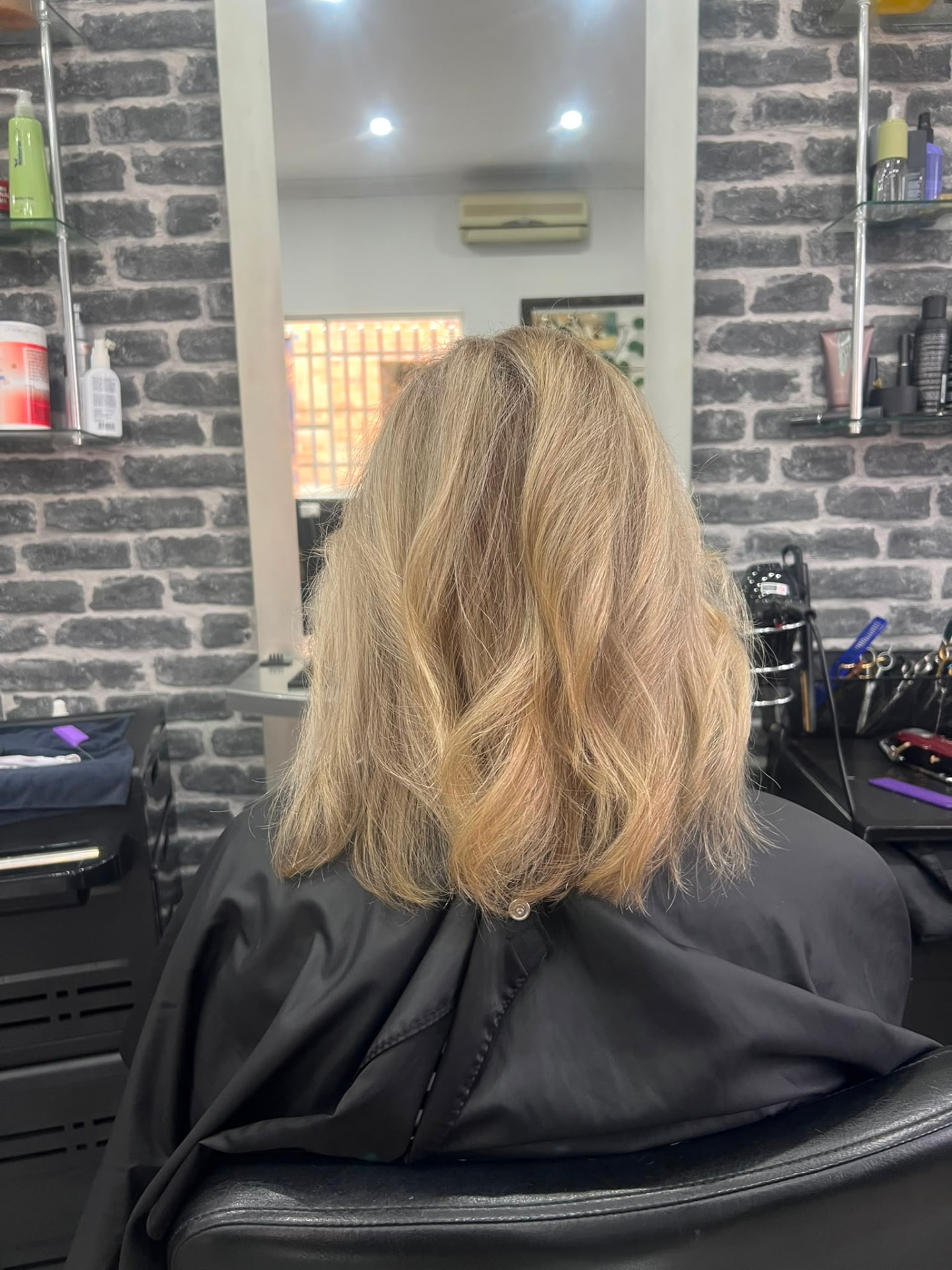 Shoulder length blonde layers with a soft salon finish