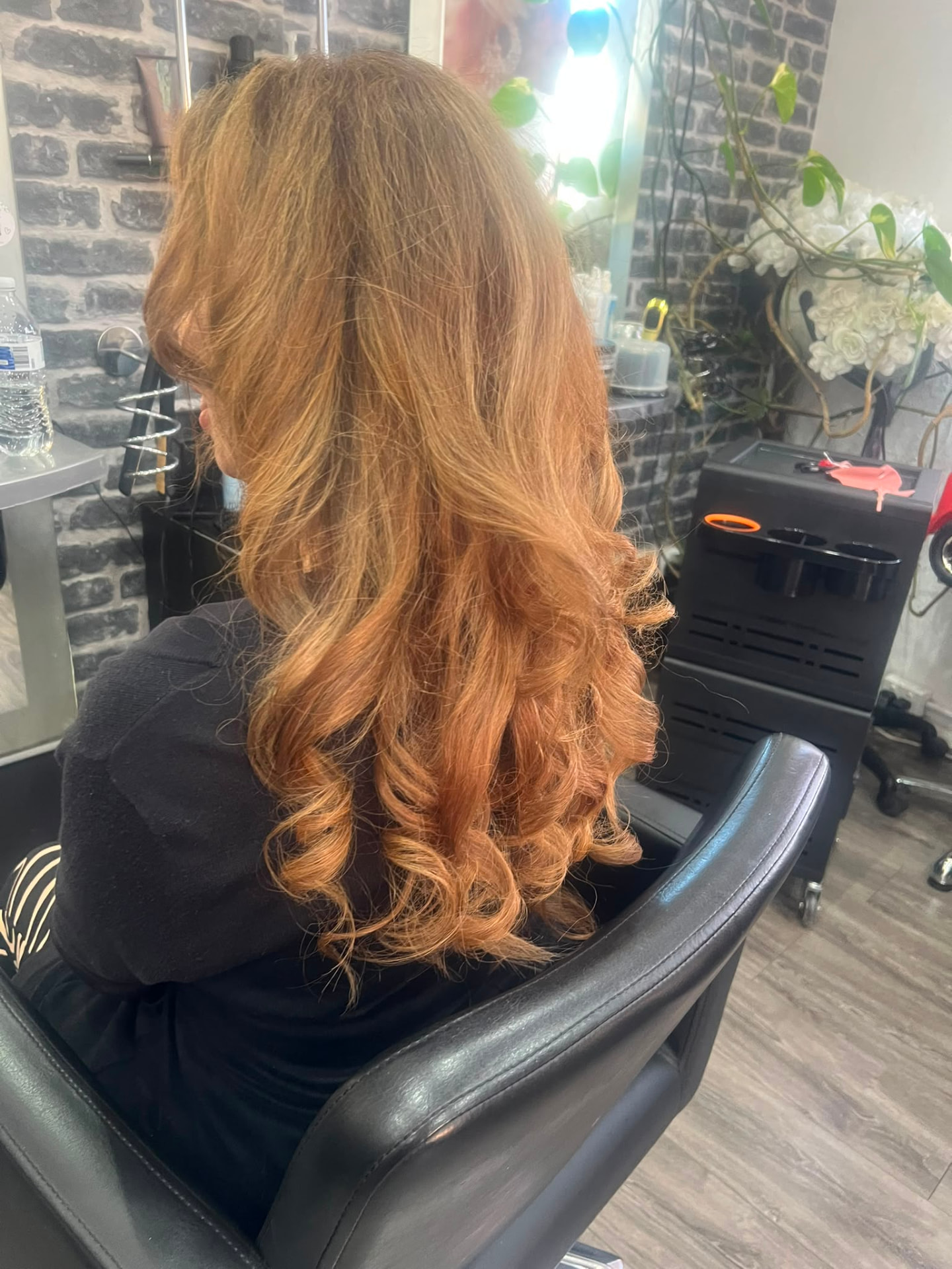 Long copper hair finished with soft curls at Catherines Hair & Beauty