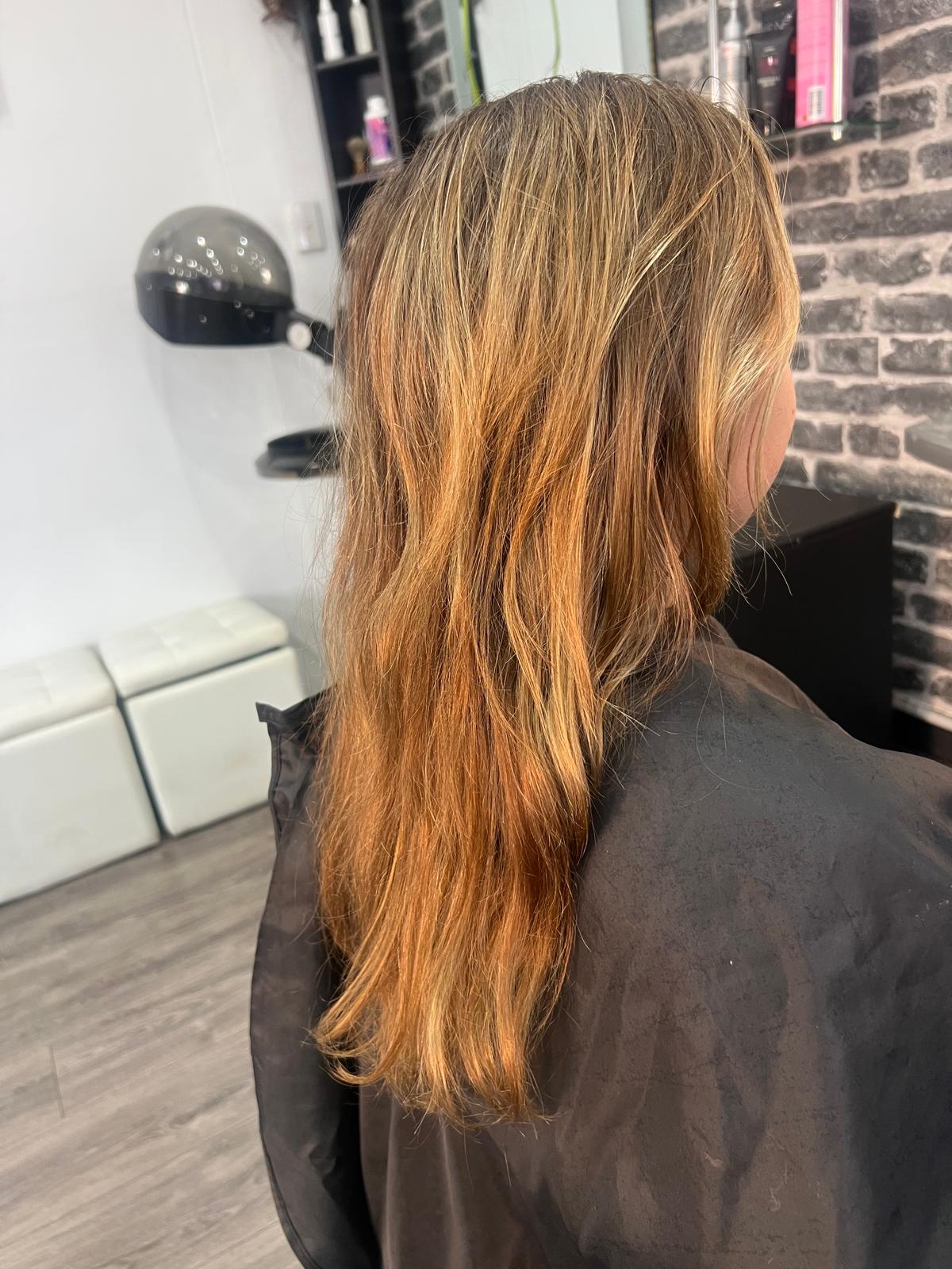 Warm copper and blonde blended colour on long hair