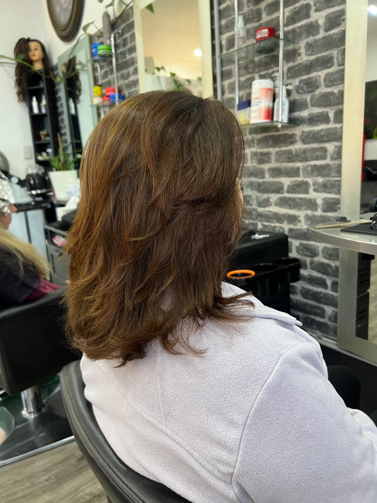 Textured shoulder length layered brunette haircut