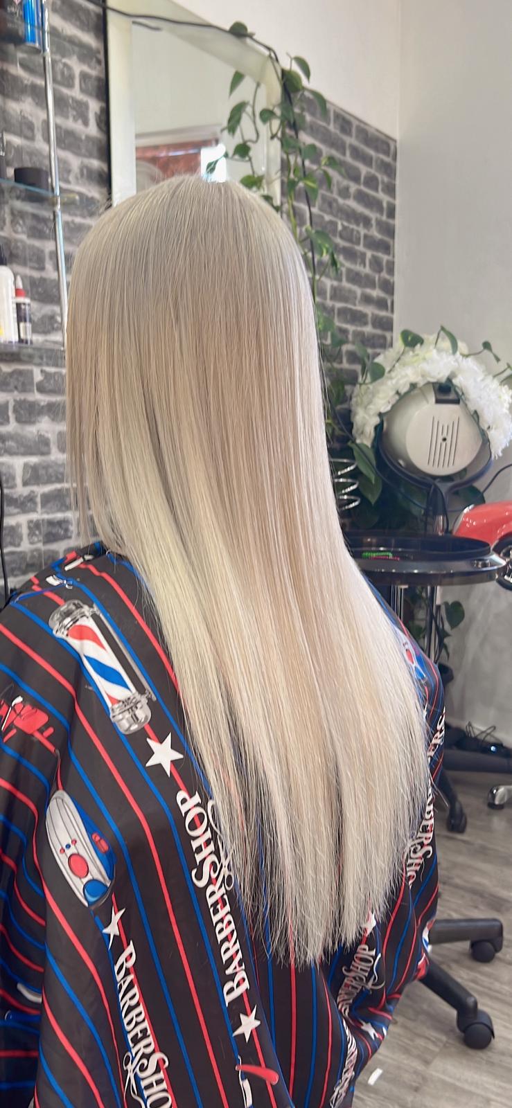 Sleek icy platinum blonde hair after a full bleach and toner