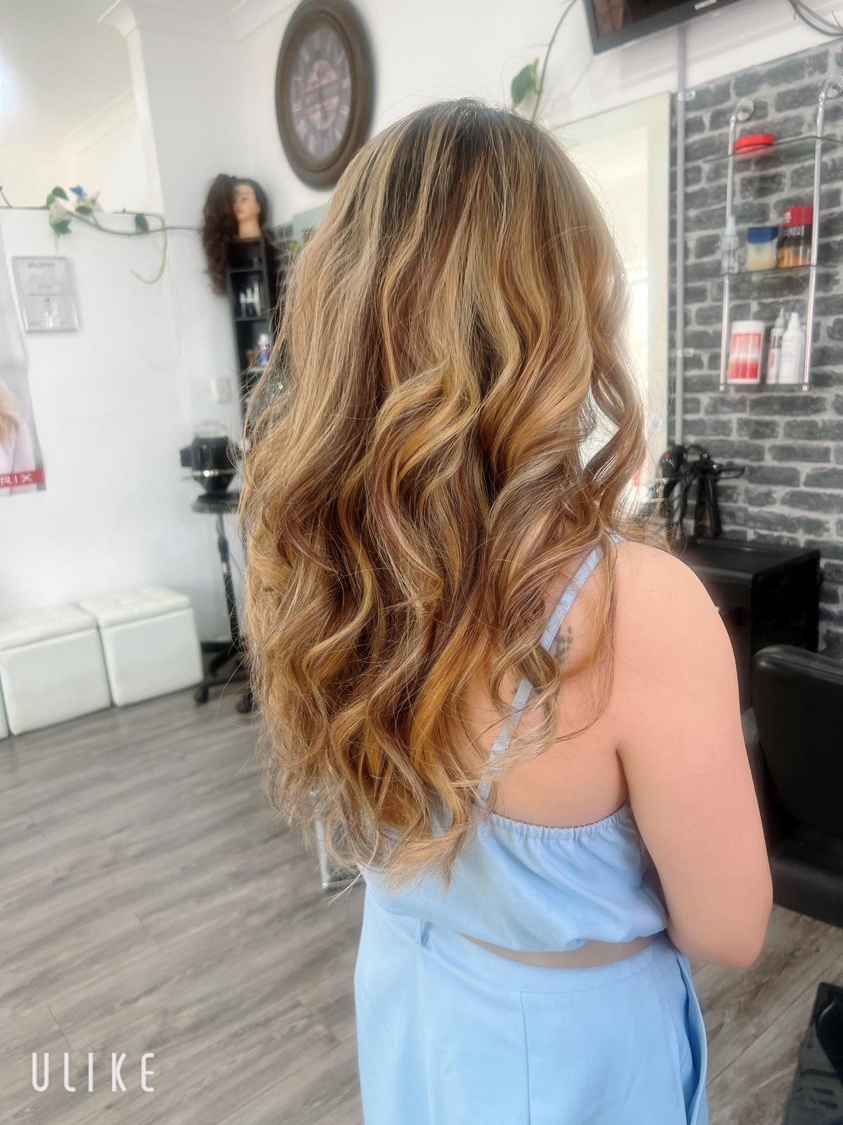 Long honey balayage waves styled at Catherines Hair & Beauty Marrickville